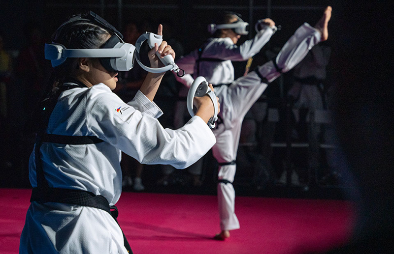 Pertandingan Virtual Taekwondo digelar pada Juni 2022 di Olympic Esports Series. Foto di atas adalah para pemain Taekwondo yang sedang memainkan pertandingan Virtual Taekwondo berdasarkan game.