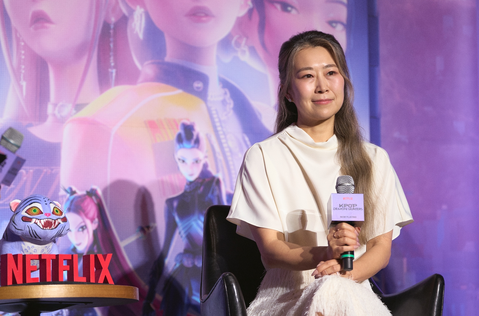 Maggie Kang, Kreator sekaligus kodirektur KPop Demon Hunters yang telah menjadi fenomena global, pada tanggal 22 Agustus 2025 mendengarkan pertanyaan dari awak media dalam konferensi pers di CGV Yongsan I'Park Mall, Distrik Yongsan, Seoul. (Netflix)