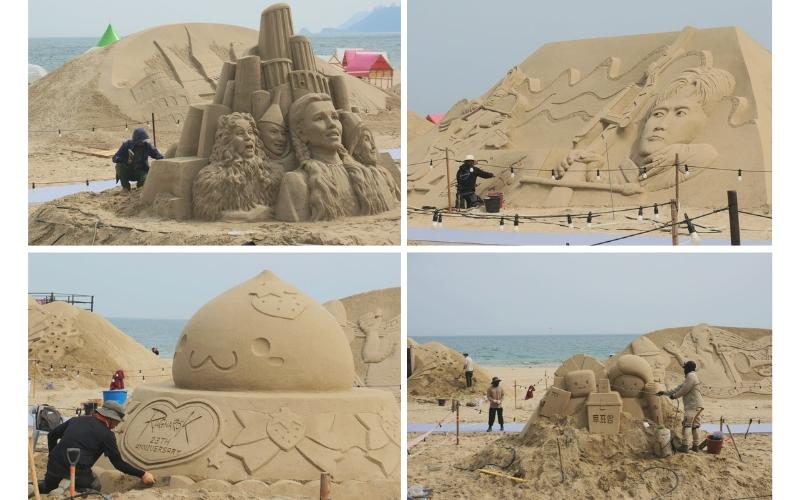 Tampak para seniman patung pasir menyempurnakan karya mereka sebelum Festival Pasir Haeundae resmi dibuka tanggal 16 Mei 2025.  