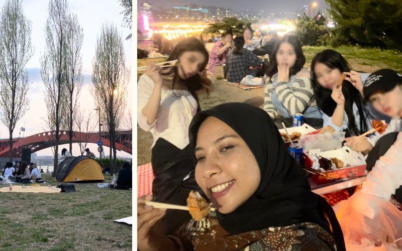 Kegiatan piknik di tepi Sungai Hangang, Seoul, menunjukkan kebersamaan dan semangat hidup berdampingan antar masyarakat lokal dan warga asing di akhir pekan.  
