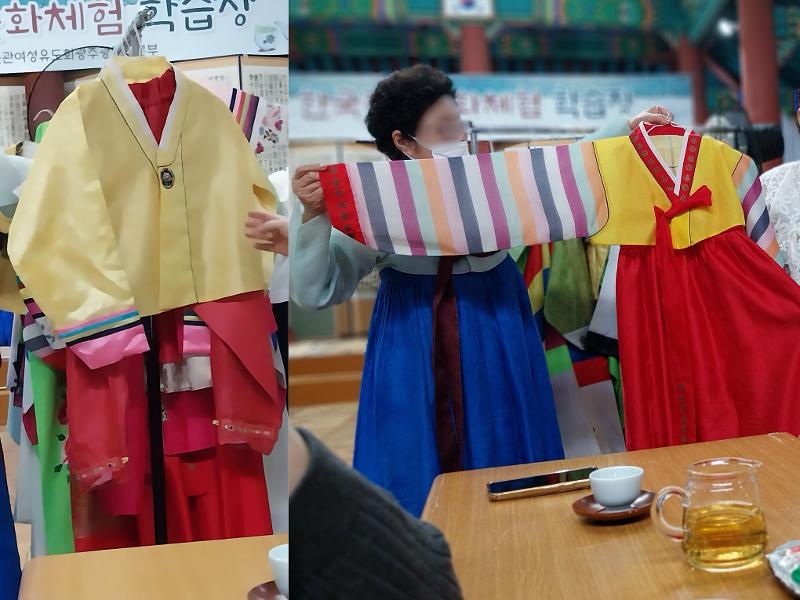 Staf menjelaskan makna warna merah pada hanbok anak-anak yang melambangkan kehidupan dan harapan. 